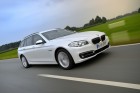 2014er BMW 520d Touring in weiß fahraufnahme